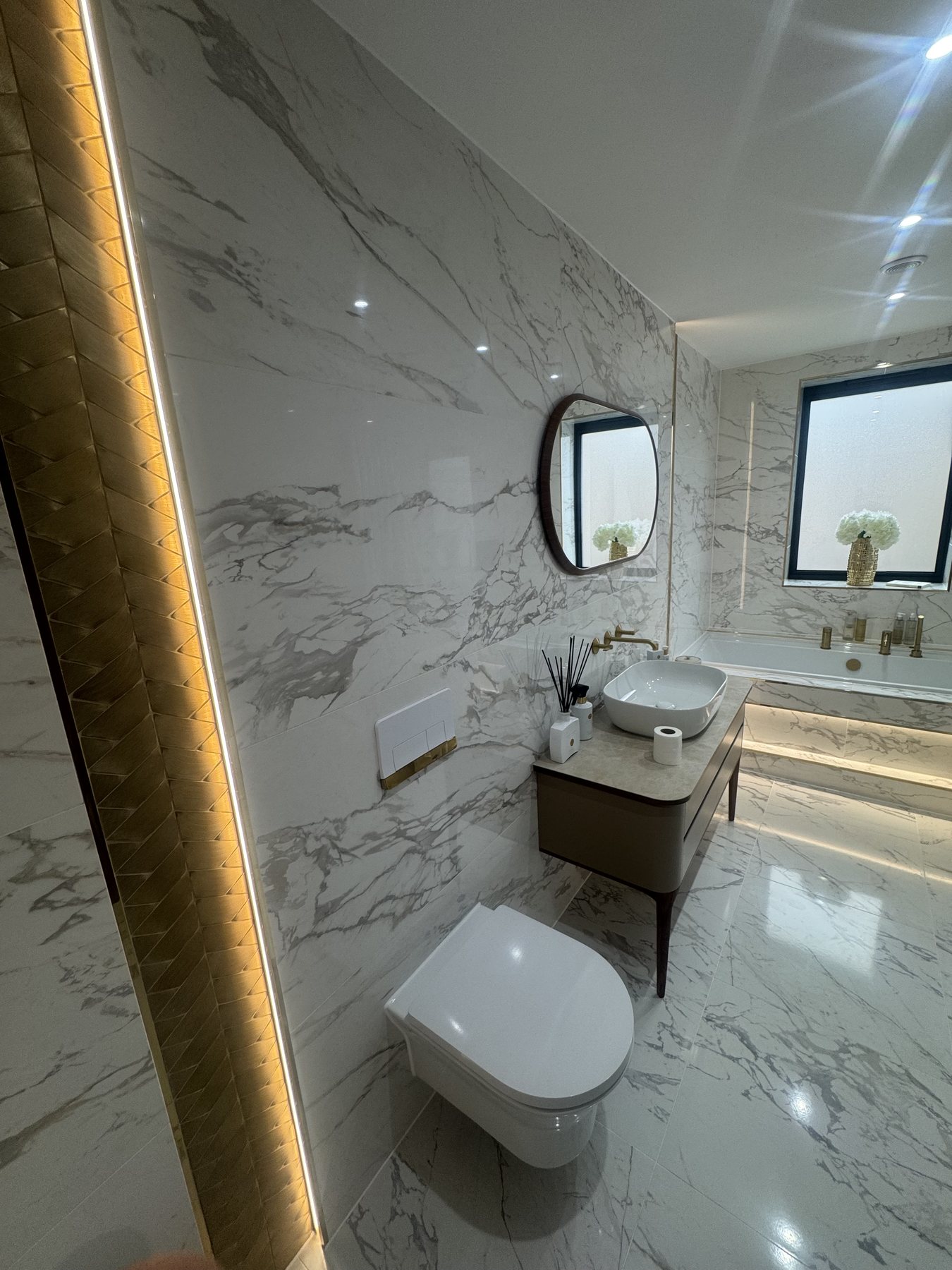 Completed marble-effect bathroom tiling